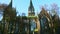 Quickly panorama up at pigeons fly above old catholic cathedral church in Lviv, Ukraine