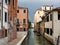Quiet back canal with reflections, Venice, Italy