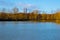 A quiet blue lake under a clear sky