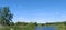 a quiet lake in Germany, surrounded by trees, forest and bushes