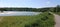 a quiet lake in Germany surrounded by trees, forest and bushes. incredibly beautiful lake panorama with a breathtaking lake view.