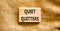 Quiet quitters symbol. Concept words Quiet quitters on wooden blocks. Beautiful canvas table canvas background. Business and quiet