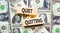 Quiet quitting symbol. Concept words Quiet quitting on wooden blocks. Beautiful background from dollar bills. Business and quiet