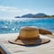 Quiet relaxation Sunhat on empty sunlounger by the beach midday