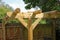 A quiet relaxing and shady area in a back garden under a pergola and magnolia tree