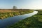 Quiet river through a meadow. Polish golden autumn