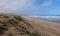 Quiet sandy beach and grassy dunes on the Oystercatcher Trail, near Mossel Bay, Garden Route, South Africa