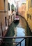 Quiet side canal lined with old residential townhouses, Venice, Italy