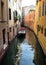 Quiet side canal lined with old residential townhouses, Venice, Italy