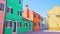 Quiet street of Burano with rows of multi-colored houses