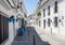 Quiet street of Mijas town in siesta time. Typical white town in Andalusia, southern Spain.