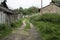 Quiet village street with an old barn