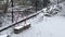 Quiet Winter Day: Snow Blanketing an Outdoor Clothesline and Woodpile in a Suburban Backyard