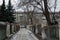 Quiet winter snowy streets, nooks and crannies of the street with houses, high fences in the city of Dnipro, Ukraine.