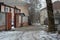 Quiet winter snowy streets, nooks and crannies of the street with houses, high fences in the city of Dnipro, Ukraine.