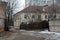 Quiet winter snowy streets, nooks and crannies of the street with houses, high fences in the city of Dnipro, Ukraine.