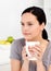 Quiet woman drinking her coffee in the kitchen