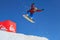 Quiksilver Camp is a winter mountain sports and entertainment activity for ski and snowboard riders. A man snowboarder flies from