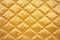 quilted satin tablecloth in gold, close snapshot