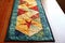 quilted table runner with seasonal decorations