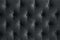 Quilted velour buttoned ultimate grey color fabric wall pattern background. Elegant vintage luxury dark black steel metal colour
