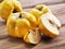 Quince fruits on wooden table.