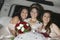 Quinceanera Sitting With Friends In Limousine