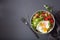 Quinoa bowl with fried egg, avocado, tomato, rocket. Healthy veg