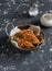 Quinoa crusted chicken in a metal bowl.