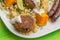 Quinoa with roasted pumpkin, falafel and sausages