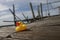 Quirky Quacks: Low-angle Shot of a Yellow Duck Toy on Wooden Floor