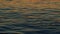 Quite Background Of Sea At Sunset With Orange Reflections. Abstract Golden Reflection On Water Sunset. Slow motion.