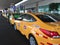 Quito, Ecuador - 14-7-2019: Many yellow official taxi`s lined up and waiting for passengers