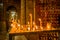 QUITO, ECUADOR, FEBRUARY 22, 2018: Close up of candles over a metallic structure inside of Santo Domingo Church in Quito
