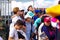 QUITO, ECUADOR - JULY 7, 2015: Adults, woman and men, paying attention to pope Francisco mass, sunny day