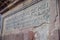 QUITO, ECUADOR - NOVEMBER 23, 2016: Description over a stoned wall in outside of historic Plaza de Santo Domingo in old