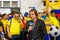 QUITO, ECUADOR - OCTOBER 11, 2017: Close up of reporter talking to some ecuadorian fans surrounding with a crowd of