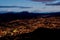 Quito at night with cotopaxi mountain