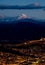 Quito at night with cotopaxi mountain