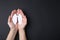 Quitting smoking concept. Woman holding paper lungs on black background, top view and space for text