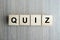 QUIZ text wood cube   on wooden table background