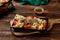 Qunioa salad with beans, tomato, cucumber and sauce served in a dish isolated on wooden table background side view of salad