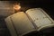 The Qur`an, the holy book of Islam. worship month of Ramadan, reading the scriptures by using a candle light.