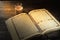 The Qur`an, the holy book of Islam. worship month of Ramadan, reading the scriptures by using a candle light.