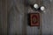 Quran and candles on a wooden surface.