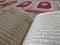 Quran on elegant Persian rugs - the Arabic text with English translation.