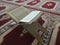 Quran on elegant Persian rugs - the Arabic text with English translation.
