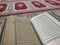 Quran on elegant Persian rugs - the Arabic text with English translation.