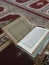 Quran on elegant Persian rugs - the Arabic text with English translation.