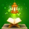 Quran with lamp on Eid Mubarak background